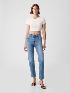 Fit: A full-length classic straight-leg jean that's slim through the hip & thigh.  Fabric: 83% Cotton, 11% Polyester, 5% Recycled Cotton, 1% Stretch.  Stretch: Low Stretch Jeans.  Looks like vintage denim but feels like you've had them forever.  ​Easy & comfortable with a little secret stretch.  Rise: High Rise Jeans.  Look: A classic five-pocket jean in a medium indigo wash.  Details: Zip fly & five-pocket styling.  Responsibly Made: This pair of jeans is part of our water-saving Washwell program.  Compared to conventional wash methods, Washwell has saved millions of liters of water since 2016.  Our High Rise Jean has an 11" 28 cm) rise. ​ Slim through the hip & thigh.  Straight leg.  Full-length jean.  Hits below the ankle.  Inseam: Short 29" 73. 5 cm), Regular 30. 5" 77), Long 32. 5" 82 Gap Straight Leg Jeans For Fall, Fitted Mid-rise Cropped Jeans In Rigid Denim, Gap High Waist Jeans For Fall, Gap Classic Jeans For Fall, Gap Straight Leg Relaxed Jeans, Gap Relaxed Fit Straight Leg Jeans, Gap Mid-rise Jeans For Fall, Gap Jeans For Everyday Wear In Fall, Gap Jeans For Everyday Fall Wear