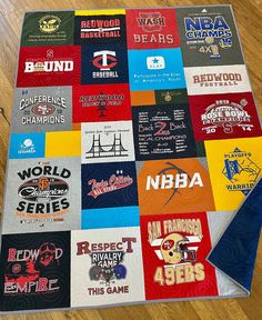 a quilt made to look like it has many different sports teams on it and is laying on the floor