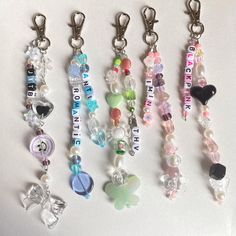 several key chains with charms attached to them