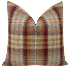 a plaid pillow on a white background