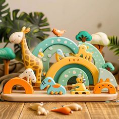 an assortment of wooden toys sitting on top of a table