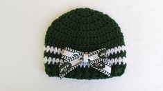 "Hand crochet hat in Jets Hunter and White.  For that baby born a Jets fan.  Made in nice quality soft acrylic yarn. Bow is held onto hat by a small plastic barrett that is glued securely to the bow.  Easy to remove bow for washing,   hand wash, machine dry.  When babe outgrows hat it's a Indy hairbow. Sizes  Newborn 12\" by 5\" Made by me in my smoke free Ohio home." Crochet Jets Hat, Hat New York, Jet Fan, Baby Born, Crochet Handmade, Baby Hat, Crochet Hat, New York Jets, Cute Bag