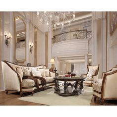 a living room filled with furniture and a chandelier