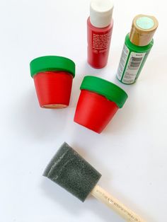 the paint is red, green and white next to some other paints on a white surface