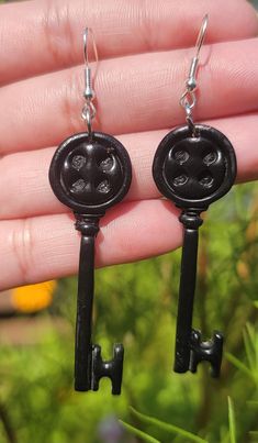 The Coraline Earrings are available in a variety of styles. You can choose to select Button Pairs Earrings, Seeing Stone Earrings, or a Mix and Match ( 1 Button and 1 Seeing stone).  All of the earrings are handcrafted using polymer clay, baked, sanded, assembled, and then sealed with a high gloss varnish. ⭐️They are super light-weight and no pull on the ear⭐️ ⭐️ Please note the earrings are handmade with clay and are fragile. Please do not bend or they may break. Each earring is handmade, there Coraline Earrings, Coraline Key, Earrings Handmade Clay, Key Earrings, Anime Earrings, Handmade Clay Earrings, Handmade Clay, Fantasy Jewelry, Coraline