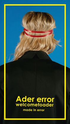 the back of a woman's head wearing a black shirt with yellow border around it