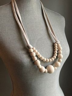 Monochromatic double strand painted mixed round wooden bead necklace in Light Mocha (cream). Hand painted wooden bead necklaces in gorgeous colors on knotted cotton t-shirt yarn with a tie closure. Matte finish beads give these pieces a modern, contemporary, clean look while the natural materials are authentic, comforting, and easy to wear. Tie closures are adjustable to varying lengths, but the length listed is recommended. Picture of back knot closure shows finished ends and suggested knotting, actual length of ends will vary depending on necklace and preferred length of necklace. I've included several photos of the item in varying natural light in order to show the color as best as possible. I choose the colors based on what inspires me and what season we are in and hand paint the beads Mocha Cream, What Inspires Me, Wooden Bead Necklace, Wooden Bead Necklaces, Bead Necklaces, Hand Paint, T Shirt Yarn, Bead Necklace, Wooden Beads