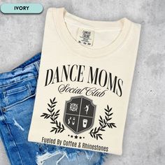 🩰☕Show Your Dance Mom Pride: Dance Moms Social Club TShirt 🪩Calling all dance moms! This cozy and stylish shirt is the perfect way to rep your squad, the Dance Moms Social Club! 🎁 Makes a great gift for the special dance mom in your life.  IMPORTANT Mockups are used for demonstration purposes only, and the final product may vary slightly in color & placement. ❤️SIZE & FIT: Comfort Colors Unisex Cotton Tee **Size up 1 or 2 if you like a cozy oversized fit. 💌 CARE INSTRUCTIONS: * Wash inside out, in cold water, on gentle cycle. Tumble dry low or let air dry * Do not use Fabric Softeners or Bleach * Do not dry clean. *Avoid ironing on the design. 📦SHIPPING: Once order is placed production takes 1 to 3 days. Standard Shipping 3-5 business days after production time. USPS does experience r Dance Mom Competition Shirt, White Cotton T-shirt For Dance Class, Cotton T-shirt With Letter Print For Dance Class, Cotton Hip Hop T-shirt For Dance, Cotton Graphic Tee For Dance Class, Hip Hop Dance Cotton T-shirt, Cotton Hip Hop T-shirt For Dance Class, Cotton Crew Neck T-shirt For Dance Class, Casual Cotton T-shirt For Dance Class