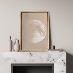 a white fireplace with a painting on the mantle