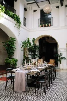 an indoor dining area with tables and chairs