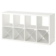 a white bookcase with six cubbys on it