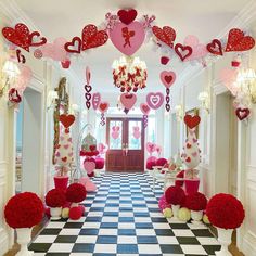 a hallway decorated for valentine's day with heart decorations