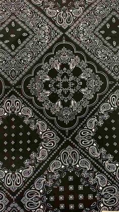 an intricate black and white pattern on fabric