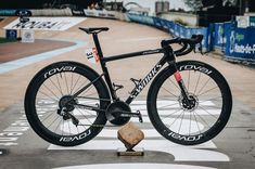 a bike is parked on top of a skateboard