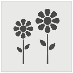 three flowers that are black and white on a gray background