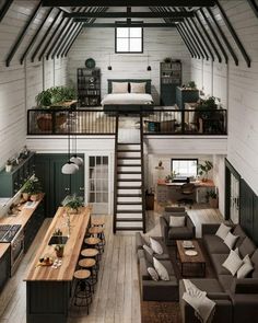 an open loft with stairs leading to the second floor and living room on top of it