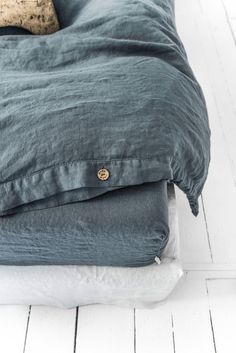 a bed with two pillows on top of it