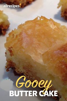 gooey butter cake on a white plate with the words gooey written below it