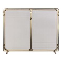 a gold metal fireplace screen with two panels on the front and sides, both closed