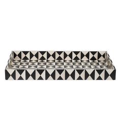 a black and white tray with triangles on it