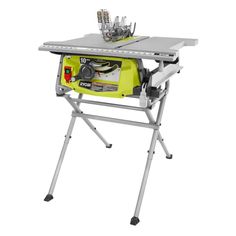 a table sawing machine sitting on top of a metal stand with tools in it