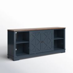 an entertainment center with doors and shelves on one side, against a white wall background