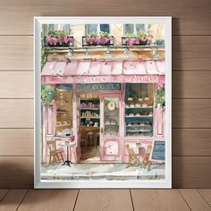 a painting of a pink store front with flowers in the window