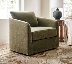 a chair sitting on top of a rug in a living room