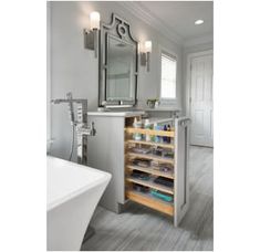 a bathroom with a sink, mirror and shelving unit in the middle of it