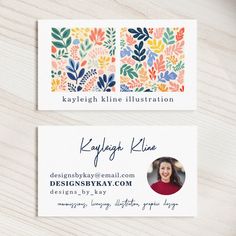 two business cards with an image of flowers and leaves on the front one has a photo of a woman's face