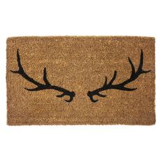 a brown door mat with antlers drawn on the front and side of it, against a white background