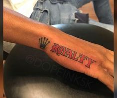 a man's hand with the word royalty on it and a crown in red ink