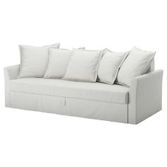 a white couch with six pillows on the back and one pillow that is folded down