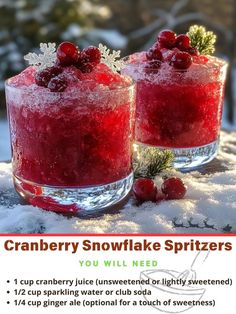 two glasses filled with cranberry snowflake spritzers sitting in the snow