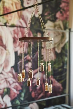 <p>Hang this mobile in your space for a magical effect! This multi stone piece features graduated bottles hanging from a circular piece of wood with chains and a circle o-ring for easy installment. The antique-inspired bottles are full of various genuine crystal chips, including yellow aventurine, red jasper, rose quartz, moonstone and tiger’s eye. Yellow aventurine is a detoxifying stone that clears out old energies to make way for new ones. It stimulates creative thoughts and ideas, so i Earthbound Trading Company, Yellow Aventurine, Creative Thoughts, Meditation Corner, Skull Keychain, Origami Paper Art, Crystal Chips, Potion Bottle, Rose Quartz Stone