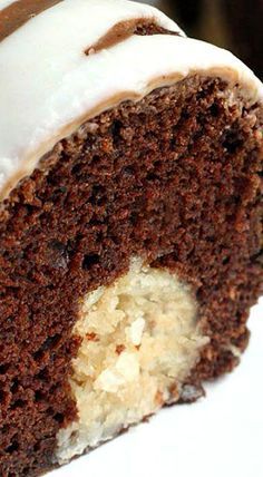 a piece of chocolate cake with white frosting