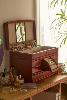 a jewelry box sitting on top of a wooden table