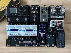 several different types of guitar pedals sitting on top of each other