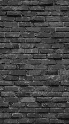 a black and white photo of a brick wall that has been made to look like it is