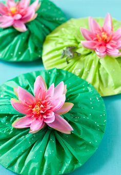 three green and pink paper plates with flowers on them