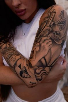 a woman with a tattoo on her arm