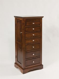 a tall wooden cabinet with five drawers