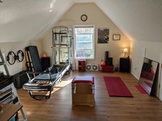 the room is full of yoga mats and exercise equipment