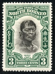 an old postage stamp with the image of a woman in black and green on it