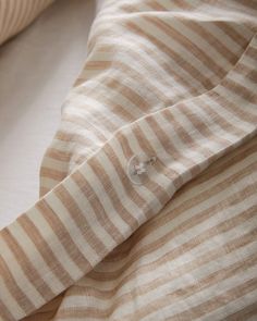 a close up of a shirt on a bed