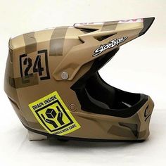 the helmet is camouflaged with yellow stickers