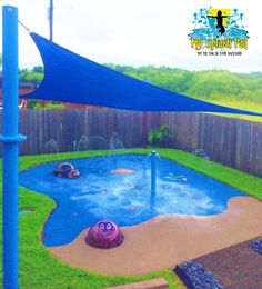 an inflatable water play area with blue tarp