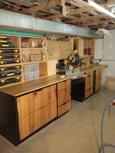 a workbench with lots of drawers and tools