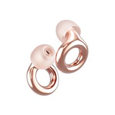 two rose gold earrings on white background