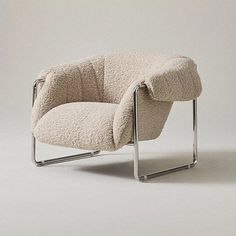 the chair is made out of sheep's wool and has a metal frame on it